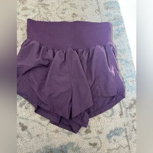 FP Movement by Free People Carpe Diem shorts in a deep purple color medium